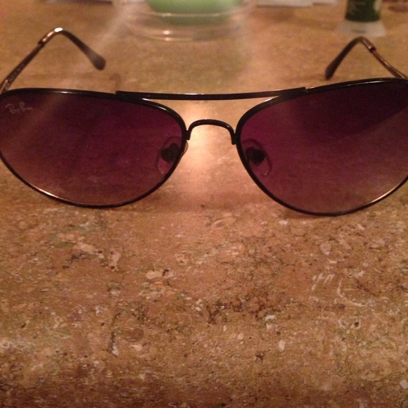 Black and fades to purple raybans not new.