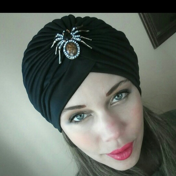 one of a kind black turban with spider jewel