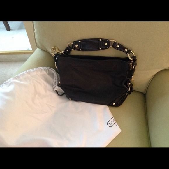 Beautiful leather Coach purse satin inside