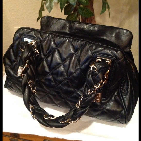 Black leather Chanel style bag