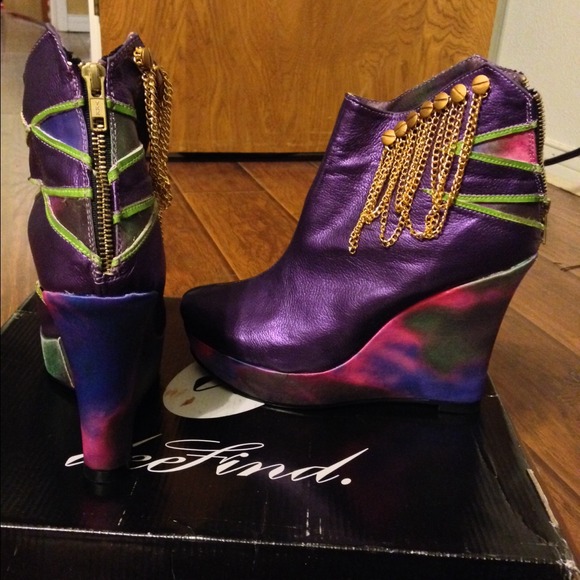 Never worn brand new designer purple booties.