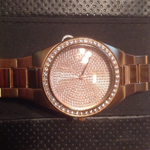 Rose gold guess watch.