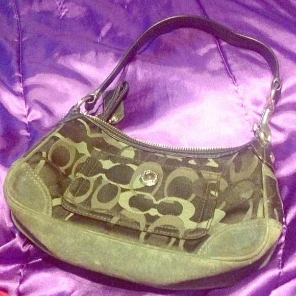 Small Coach purse. Black. Two inside pockets.