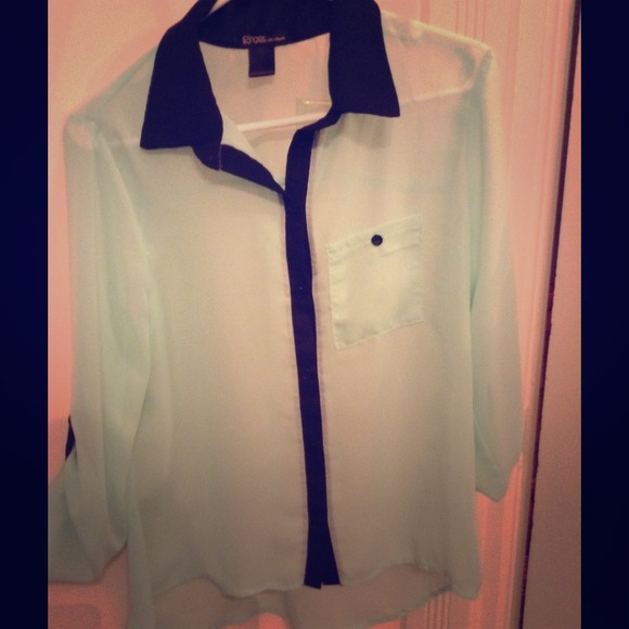 A mint grew collared shirt accented with black
