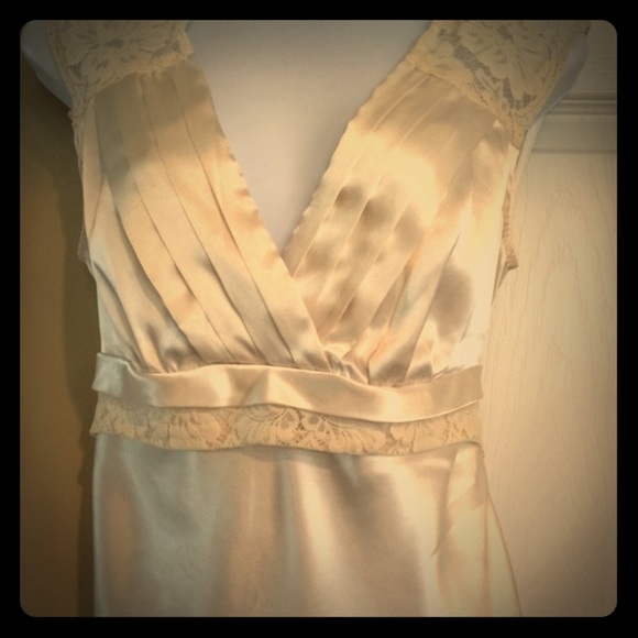 Cream colored silky lace top.