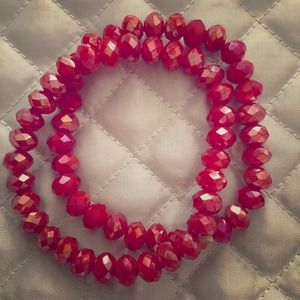 Faceted red bead bracelet on expandable string