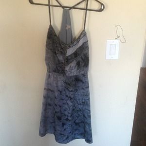 Super cute, never worn,cool back detail.