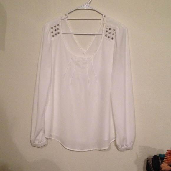 White top with studs on shoulder