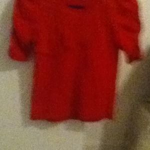 A red girls XL(14-16) short sleeved shirt