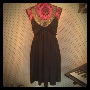 Size large black dress with detailed neckline.
