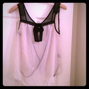 Nice cream and black colored shirt .