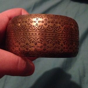 Gold engraved bracelet.