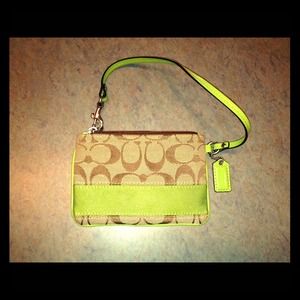 Green and tan Coach wristlet