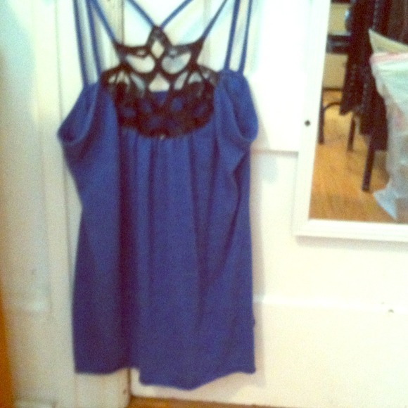 A blue tank top with a faux leather front