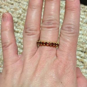 Infinity style red stone ring