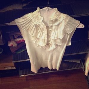 White sleeveless sweater shirt with ruffles