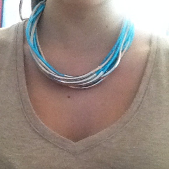 Turquoise and tan necklace.