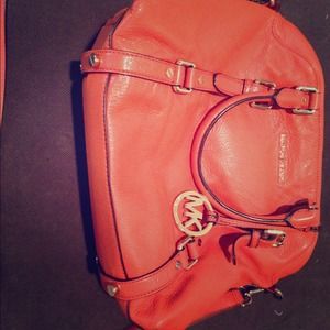 Micheal Kors tangerine leather purse!