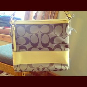 Yellow and tan Coach purse