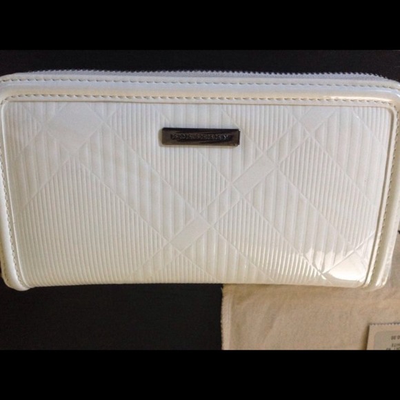 Reduced💯%Authentic Burberry Check Embossed Wallet