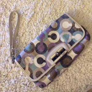 Purple coach canvas and sequin wristlet