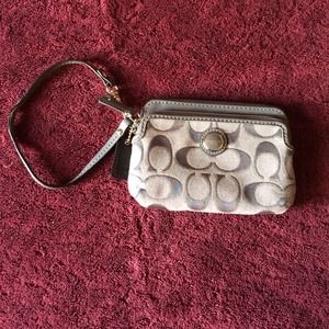 Silver/Gray Coach wristlet.
