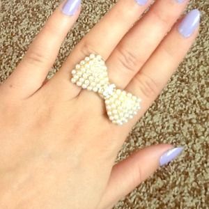 Beautiful golden bow with diamonds and pearls