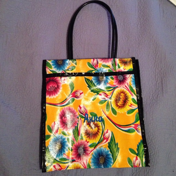 Small vinyl tote. 11" tall 11"wide and 4"deep