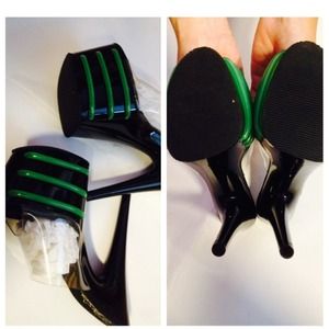 Black and green stiletto platforms