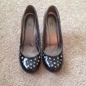 Shiny black heels with gunmetal studs