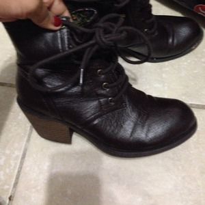 Short combat boots with small heel.