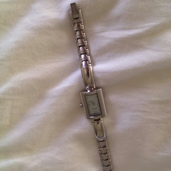 Vogue silver watch with skinny metal belt