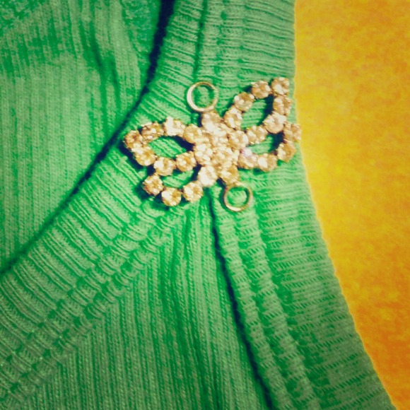 Adorable green top with dragonfly embellishment