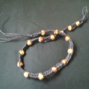 Purple hemp necklace w/intriqite beads