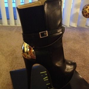 Black boots with gold accent