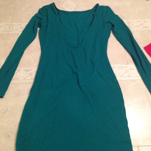 Gorgeous, fitted teal dress with a deep back cut