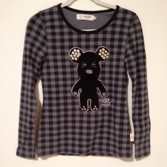 A really cute top with bear on it