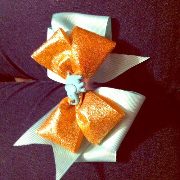 Light blue and gold bow with elephant