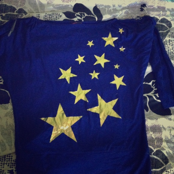 Blue shirt with gold stars.