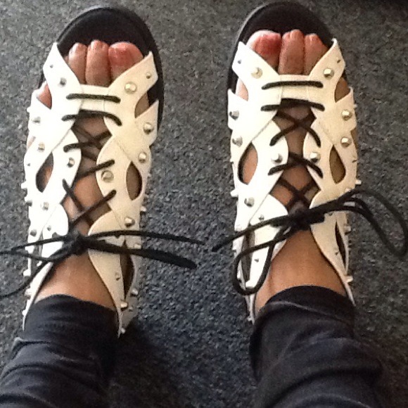 Aldo white, with silver spikes.