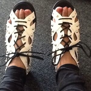 Aldo white, with silver spikes.