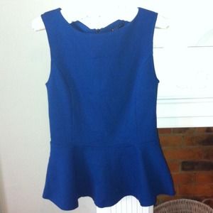 A never worn peplum top from Sisley, size small