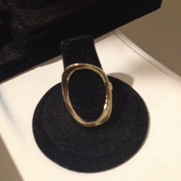 Gold colored oval ring