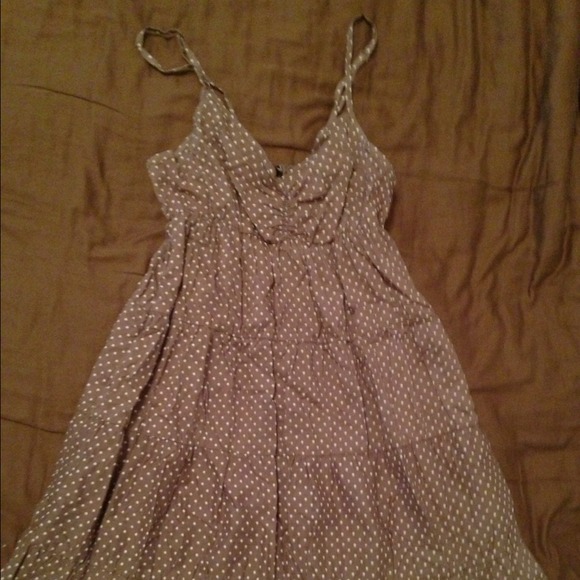 2 brown and black polka dotted dresses