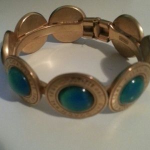 Authentic coach cuff bracelet with green stones