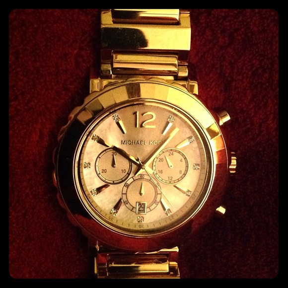 Michael Kors pearl with diamond face men's watch.