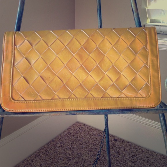 Woven mustard yellow clutch.