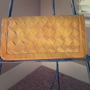 Woven mustard yellow clutch.