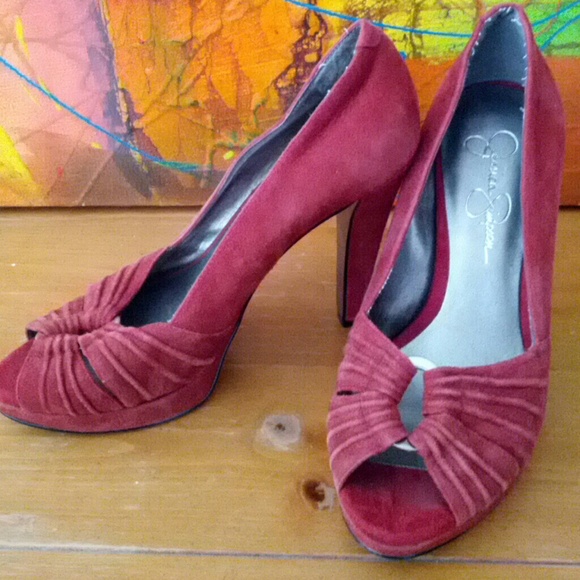 Red suede (real leather) peep toe platform pumps.