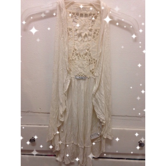 Ruffle ivory vest!